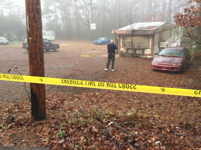 Authorities investigate a homicide at a residence in the 10300 block of Ironton Road Tuesday morning.
