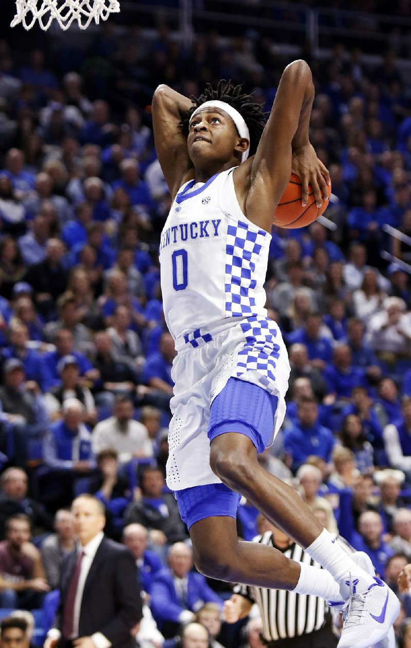 Kentucky’s De’Aaron Fox dunks for two of his 15 points during the No. 6 Wildcats’ 100-58 victory over Texas A&M on Tuesday night at Rupp Arena in Lexington, Ky.