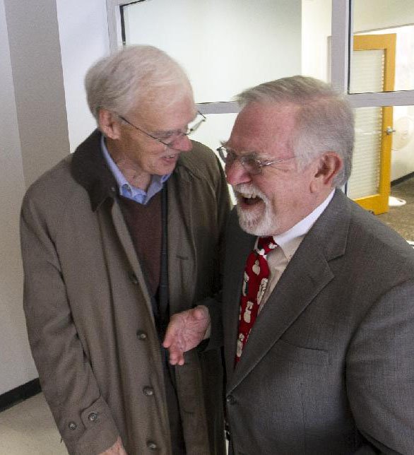 Metroplan Executive Director Jim McKenzie (right) visits with Jim Lynch and other friends and colleagues during a reception Dec. 14 honoring McKenzie with Metroplan’s Jack Evans Regional Leadership Award.