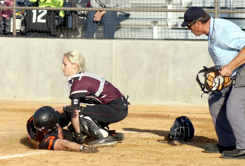 Photo by Randy Moll NWA Newspapers Lincoln catcher, Lexington Dobbs, prepares to put the tag to Gravette&#8217;s Emily Miller during her sophomore season. Dobbs signed a national letter of intent to play women&#8217;s college softball at Quachita Baptist University Nov. 14. Dobbs has been selected as female Athlete of the Year for 2016 at Lincoln by the Enterprise-Leader.