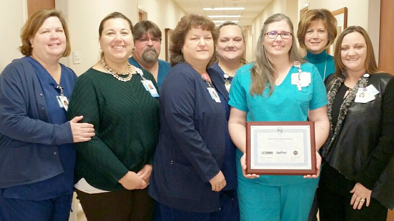 Submitted Photo Pictured with the Siloam Springs Regional Hospital&#8217;s IQI Award are: Lisa Williams, ER director; Maria Wleklinski, CNO; Jeff Copeland, radiology director; Loretta Jordan, women and children&#8217;s director; Rebecca Presley, ICU/medical surgical director; Alina Grammer, laboratory director; DJ Kimberly, abstractor; and Whitney Tolbert, quality director.