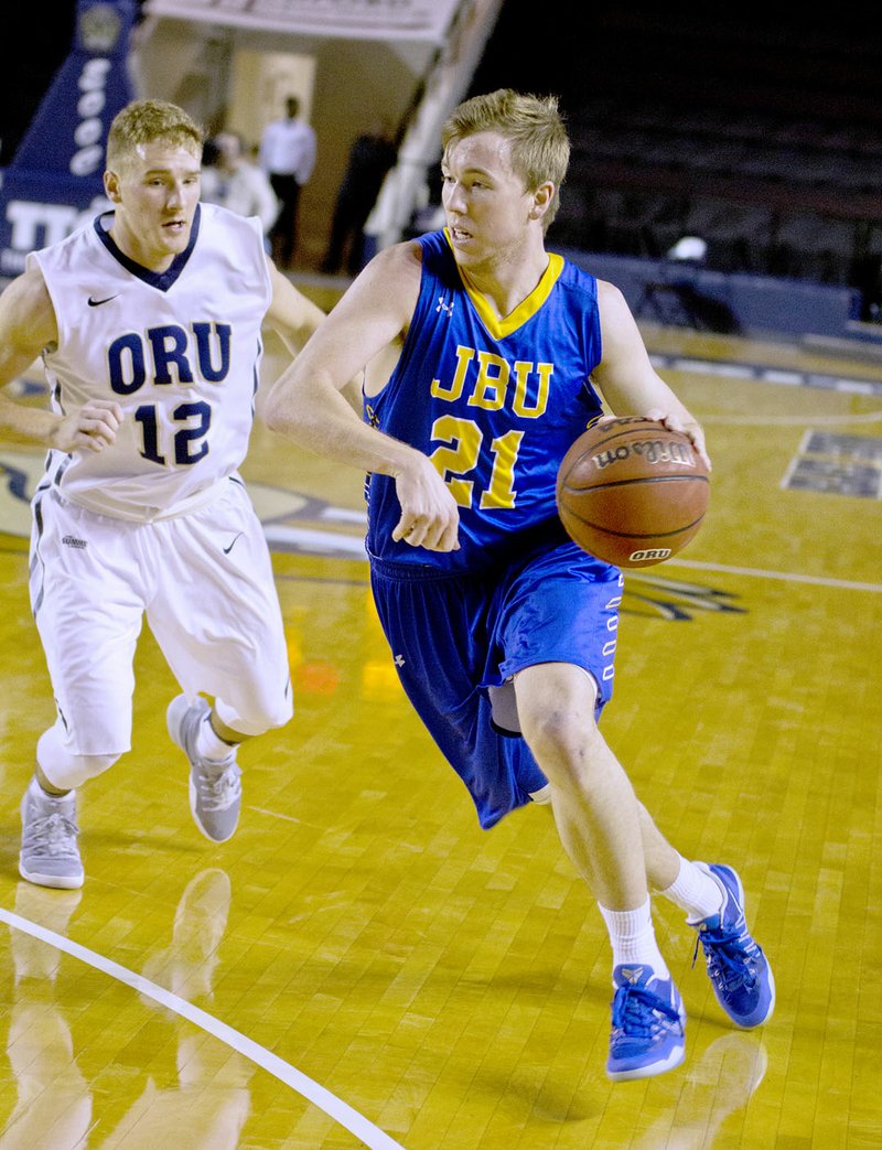 Photo courtesy of JBU Sports Information John Brown University senior Matt Ledford drives to the basket during an exhibition game at Oral Roberts on Dec. 10. Ledford and the Golden Eagles return to action at home at 8 p.m. Thursday against Southwestern Christian (Okla.).