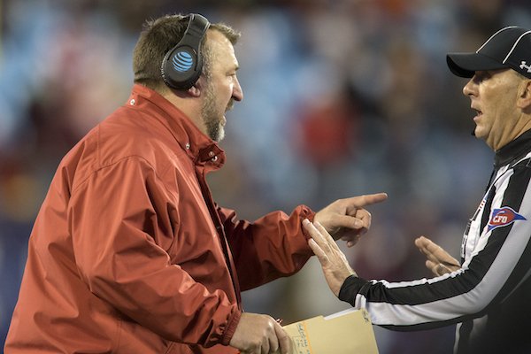 Arkansas head coach Bret Bielema speaks with an official following an inadvertent whistle in the second quarter against Virginia Tech during the Belk Bowl on Thursday, Dec. 29, 2016, at Bank of America Stadium in Charlotte, N.C.