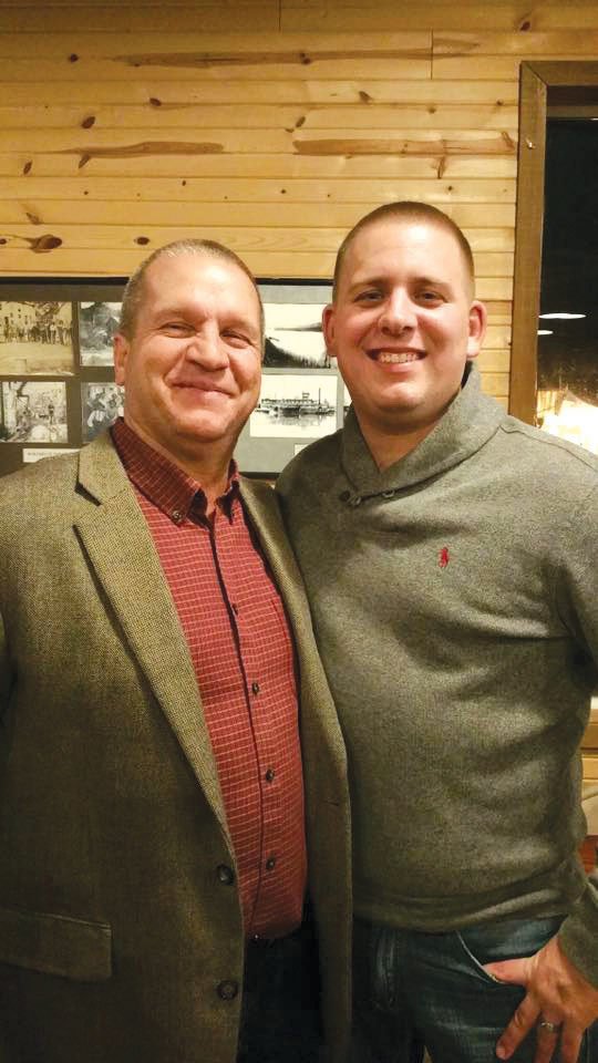 Patrolman Jordan Akins of the Batesville Police Department, right, stands with Police Chief Alan Cockrill after Akins was named Batesville Police Department Officer of the Year last month.