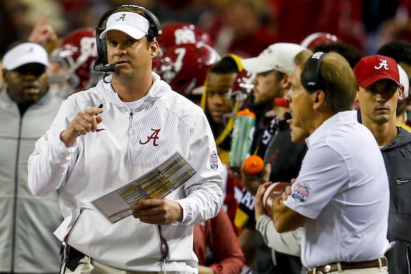 Alabama offensive coordinator Lane Kiffin makes a play call as head coach Nick Saban watches during the first half of the Peach Bowl NCAA college football game, Saturday, Dec. 31, 2016, in Atlanta.