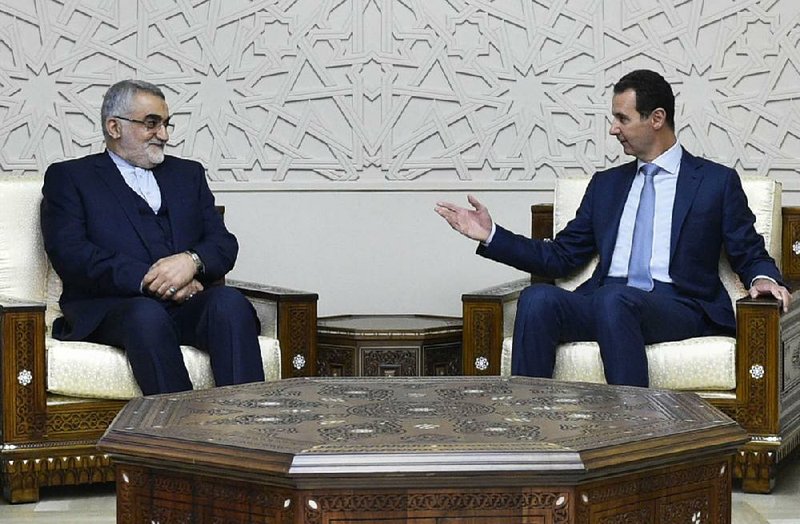 Alaeddin Boroujaerdi (left), chief of foreign policy and national security portfolios for Iran’s ruling council, meets Wednesday in Damascus with Syrian President Bashar Assad, who called Iran his “partners in the victory” in Aleppo. Boroujaerdi said retaking Aleppo was a “big step” in restoring Syria’s stability.