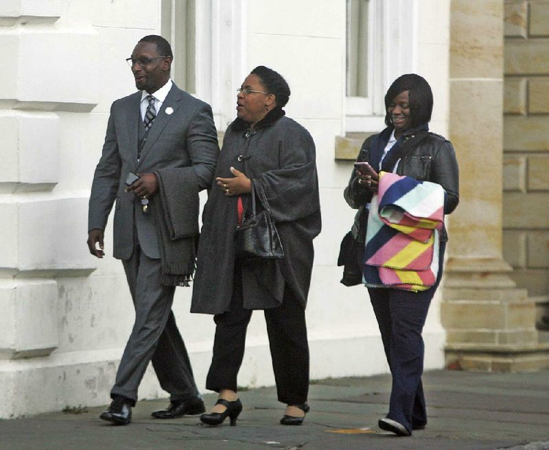 The Rev. Kylon Middleton (from left), Jennifer Pinckney, widow of Emanuel AME Church’s slain pastor, the Rev. Clementa Pinckney, and Johnette Martinez enter the courthouse in Charleston, S.C., on Wednesday for the sentencing phase of Dylann Roof’s trial.