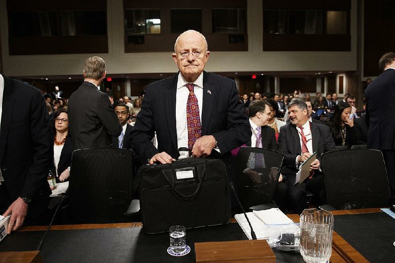 Director of National Intelligence James Clapper arrives on Capitol Hill on Thursday in Washington to testify before the Senate Armed Services Committee hearing on foreign cyberthreats.
