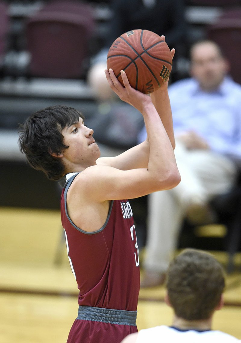 Springdale High junior Carl Fitch shoots a free throw Dec. 29 against Greenwood during the Siloam Springs Holiday Classic.