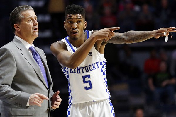 Kentucky head coach John Calipari listens to guard Malik Monk (5) in the second half of the NCAA college basketball game in Oxford, Miss., Thursday, Dec. 29, 2016. No. 8 Kentucky won 99-76. (AP Photo/Rogelio V. Solis)