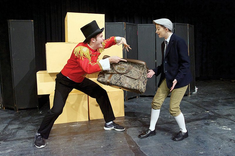 Ladahlord, left, played by Aaron Eley, offers James, played by Mallory Sullivan, a special potion from his bag of magic in this rehearsal scene from Roald Dahl’s James and the Giant Peach Jr. The play will be presented at 2 p.m. Jan. 15 and at 7 p.m. Jan. 16 in Love Auditorium at Bryant High School.