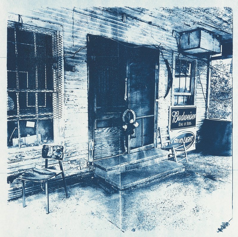 Hot Spring artist Beverly Buys will display several cyanotype photographs from her Delta in Blue series in the Arkansas Artists Retail Gallery at the Butler Center for Arkansas Studies in Little Rock. Among the photographs is this one, which she titled Shadden’s Bar-B-Q, Closed for Business. The old building is on U.S. 49 in Marvell in Phillips County.