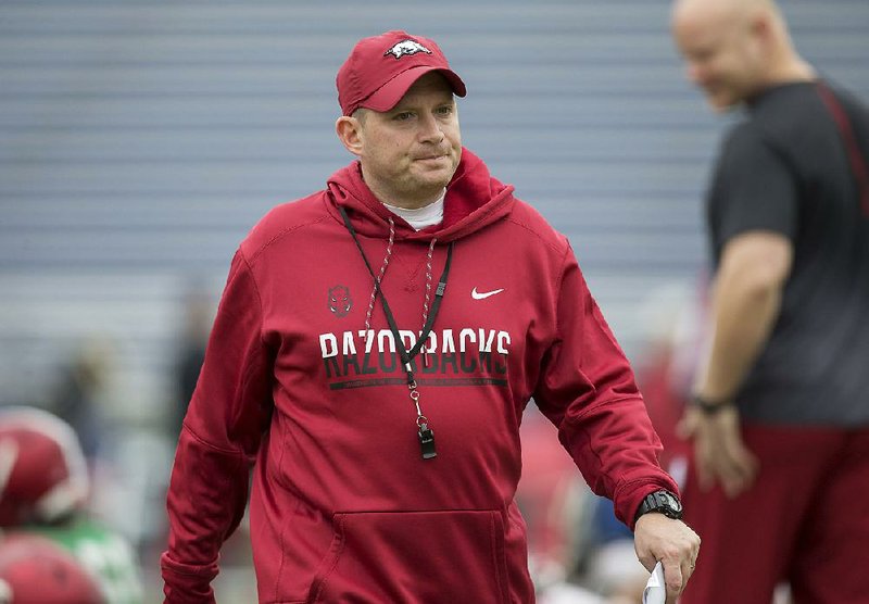 NWA Democrat-Gazette/JASON IVESTER
Arkansas defensive coordinator Robb Smith watches during Razorbacks practice on Monday, Dec. 26, 2016, at Charlotte Latin High School. The Razorbacks will play Virginia Tech on Thursday for the Belk Bowl at Bank of America Stadium in Charlotte.