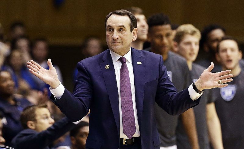 In this Nov. 29, 2016, file photo,Duke coach Mike Krzyzewski reacts during the second half of an NCAA college basketball game against Michigan State in Durham, N.C. 