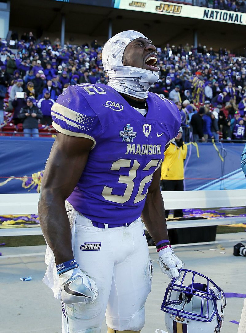 James Madison running back Khalid Abdullah celebrates after the Dukes defeated Youngstown State in the NCAA Football Championship Subdivision on Saturday in Frisco, Texas. Abdullah rushed for 101 yards and two touchdowns in the victory.