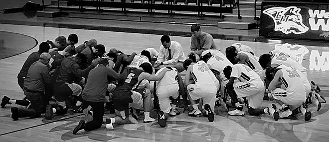Submitted photo Student-athletes from the Lake Hamilton Wolves and Lakeside Rams high school basketball teams gathered at center court after their recent contest at Lake Hamilton Wolf Arena.