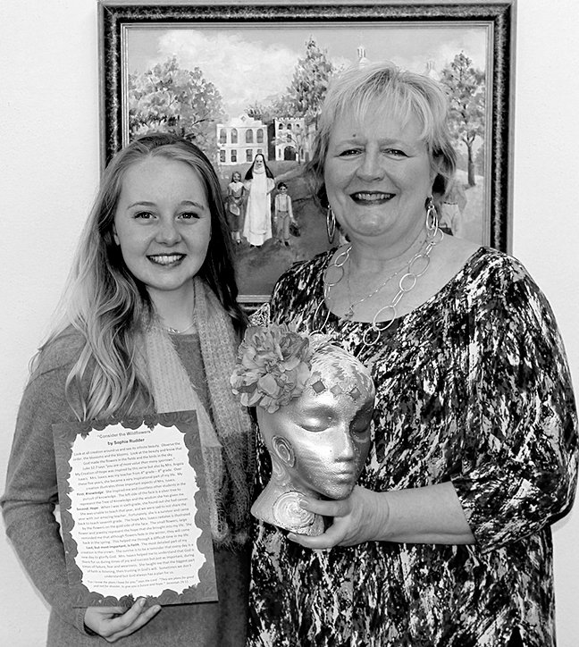 Submitted photo St. John's Catholic School alum Sophie Rudder, left, chose to dedicate her Debutante Creation of Hope to Principal Angela Isaacs, who was her elementary teacher.