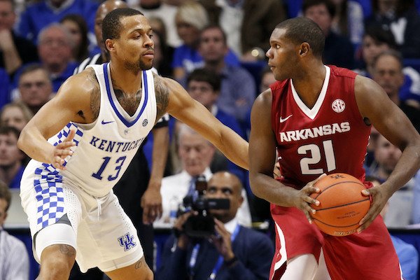 Arkansas' Manuale Watkins (21) looks for an opening on Kentucky's Isaiah Briscoe (13) during the second half of an NCAA college basketball game, Saturday, Jan. 7, 2017, in Lexington, Ky. (AP Photo/James Crisp)