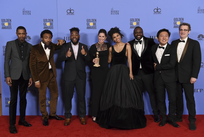 The cast and crew of "Atlanta" poses in the press room with the award for best television series - musical or comedy at the 74th annual Golden Globe Awards at the Beverly Hilton Hotel on Sunday, Jan. 8, 2017, in Beverly Hills, Calif. 