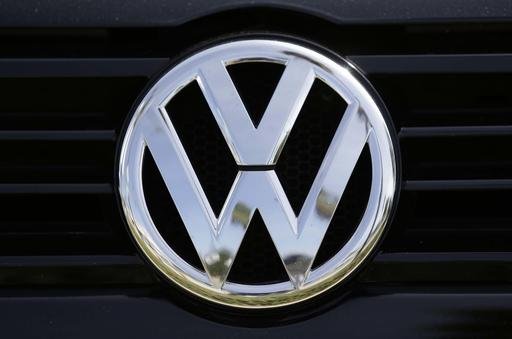 FILE - In this Sept. 21, 2015, file photo, a Volkswagen logo is seen on car offered for sale at New Century Volkswagen dealership in Glendale, Calif. (AP Photo/Damian Dovarganes, File)
