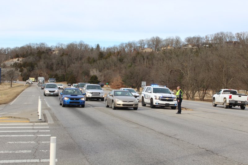 Master Sgt. Kelly Wallace directs traffic at the intersection of U.S. 71 and Riordan Road during a power outage Tuesday Jan. 10 that left most of Bella Vista’s traffic signals without power.