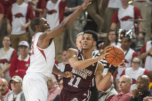 Mississippi State's Quinndary Weatherspoon is guarded by Arkansas' Manny Watkins during a game Tuesday, Jan. 10, 2017, in Fayetteville. 