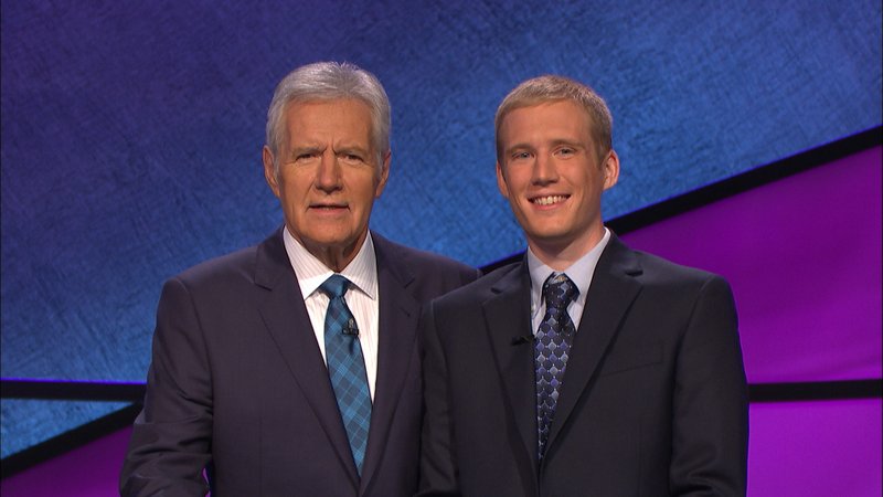 "Jeopardy!" host Alex Trebek (left) stands with Fayetteville contestant Eli Nehus (right).