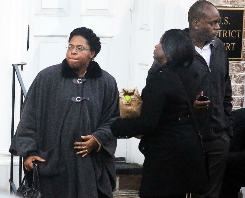 Jennifer Pinckney (left) leaves the courthouse Tuesday in Charleston, S.C., after Dylann Roof was sentenced to death in the slayings of her husband, pastor Clementa Pinckney, and eight others.