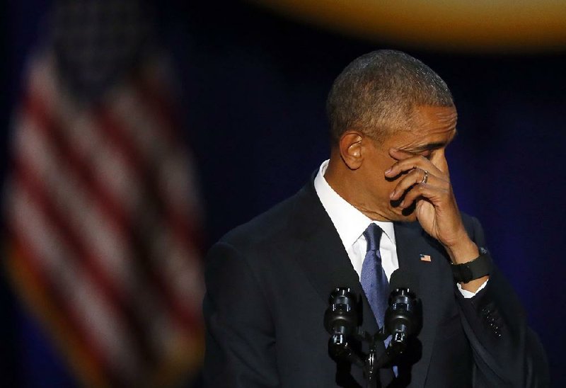 President Barack Obama pauses to wipe tears toward the end of his farewell address Tuesday night in Chicago.