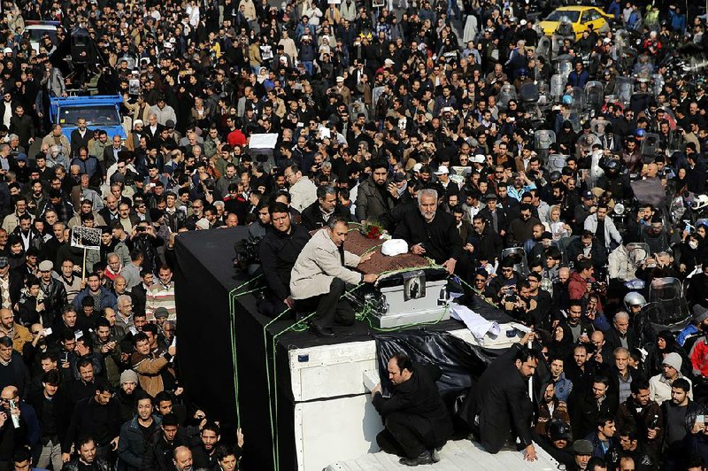 The coffin of former Iranian President Akbar Hashemi Rafsanjani is carried on a truck surrounded by mourners during his funeral Tuesday in Tehran. 
