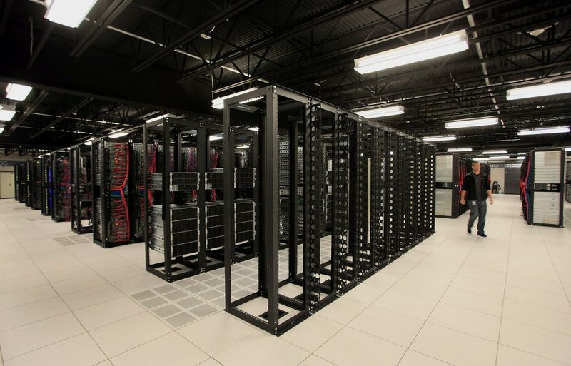An IBM employee walks through a company data center in Dallas in this file photo. International Business Machines Corp. was awarded 8,088 patents in 2016.