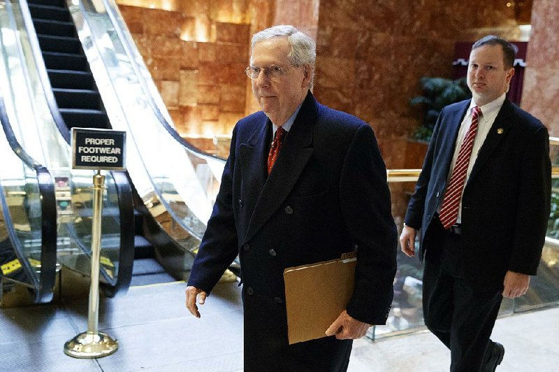 Senate Majority Leader Mitch McConnell arrives Monday at Trump Tower for a meeting with President-elect Donald Trump in New York.