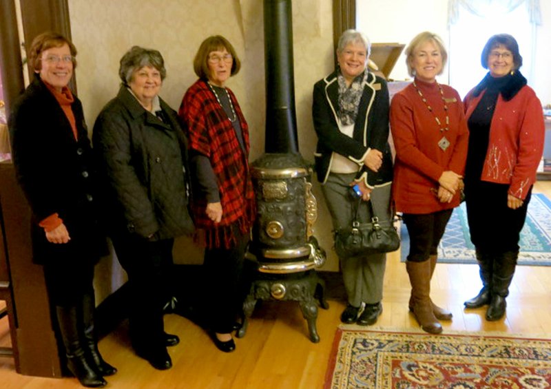 Photo by Susan Holland Six members of the Butterfield Trails Questers Chapter #949, in Bella Vista, were on hand at the Gravette Historical Museum&#8217;s historic Kindley home to present their donation of a vintage parlor stove for the home. The presentation was made Sunday, Dec. 11, following a local meeting of the Benton County Historical Society. Pictured are Xyta Lucas (left), Maryann Sweeney, Butterfield Trails Chapter president Connie Fetters, Camille Hatcher, Judy Payne and Ruth Lowery.