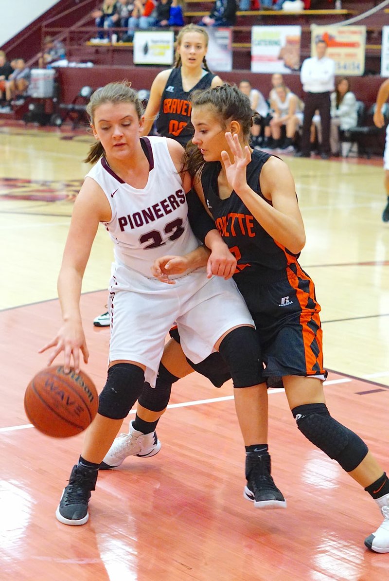 Photo by Randy Moll Haley Hays, a Gentry junior, is closely guarded by Tori Foster, Gravette junior, during the Gentry-Gravette game held at Gentry High School on Friday (Jan. 6, 2017).