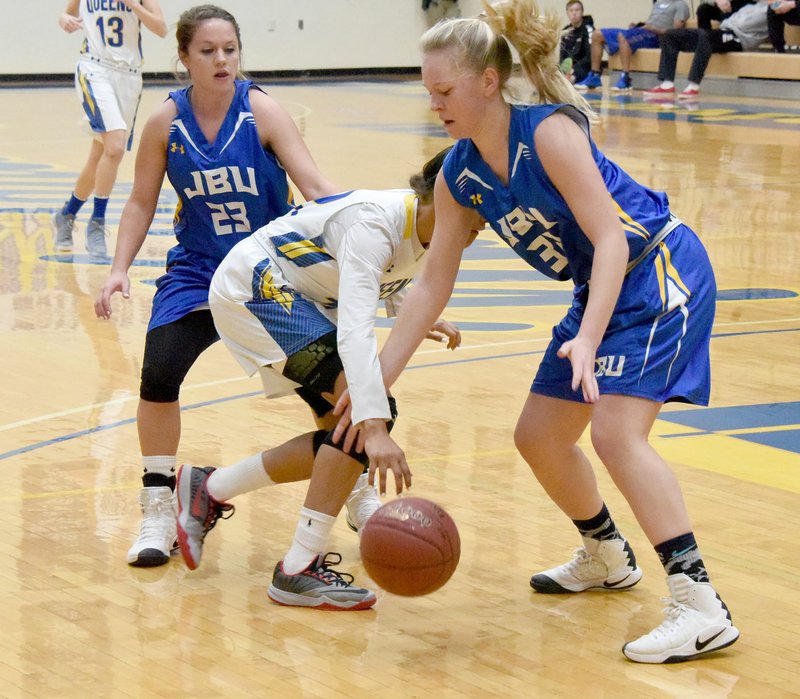 Photo courtesy of Wayland Baptist Sports Information John Brown University guard Kodee Powell, left, and forward Rosa Opro, right, defend against Wayland Baptist on Saturday. The Golden Eagles return to action on Thursday at Southwestern Assemblies of God (Texas).