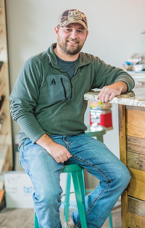 Capt. John Schaeffer, who was named the first Pottsville Firefighter of the Year, sits in his business, 
The Granite Shop in Russellville. Schaeffer, 29, has worked for the volunteer fire department for 6 1/2 years.