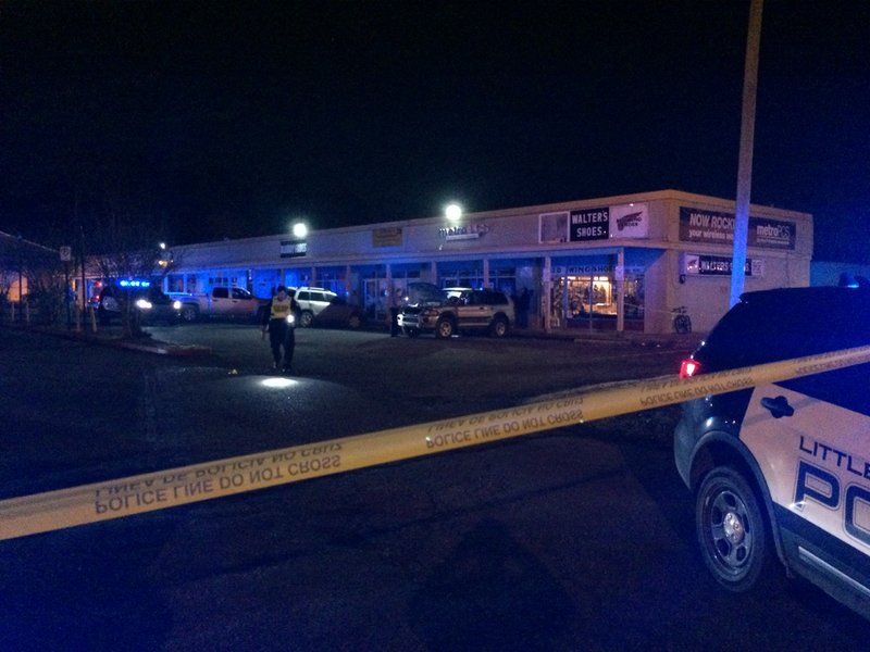Police investigate after a gunman opened fire at a Little Rock strip mall Tuesday evening.