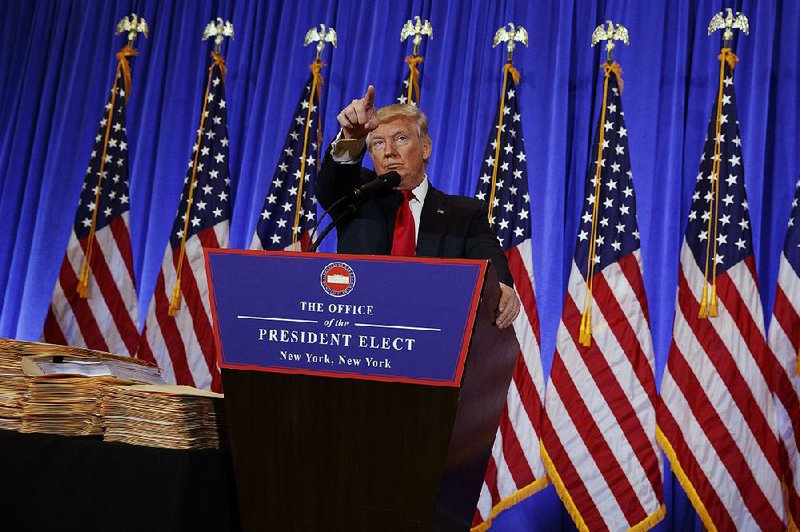 Donald Trump holds his first news conference as president-elect Wednesday in the lobby of Trump Tower in New York City. About 250 journalists crowded in to ask questions.