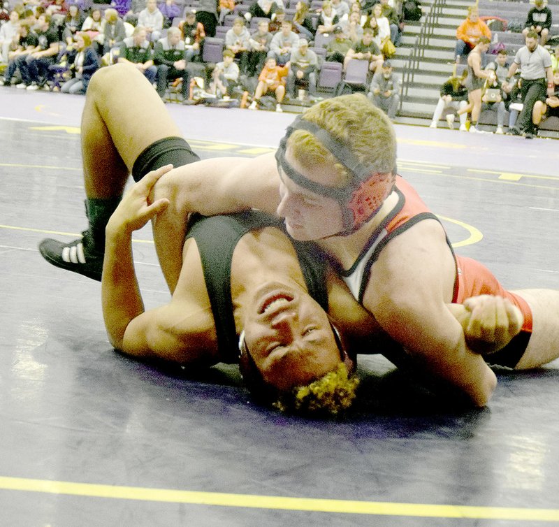 Photo by Rick Peck McDonald County&#x2019;s Truman Craig has Myron Reeves of Clinton (Oklahoma) on his back on the way to a pin to win the 160-pound division of Saturday&#x2019;s Monett Wrestling Tournament.