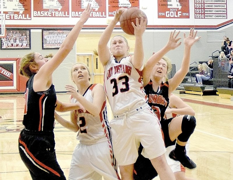 Photo by Rick Peck McDonald County&#x2019;s Kylie Helm takes the ball to the basket during the Lady Mustangs 47-26 loss to Aurora on Jan. 6 at MCHS.