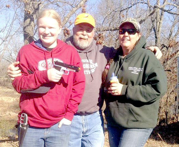 Photo submitted by Dan Fuller Abby and Adrianna Lowe of Bella Vista, Ark., were presented the &#8220;Pink Pistol Award&#8221; as the top mother/daughter team at the Young Outdoorsmen United girls-only shooting event. They placed 7 out of 10 shots in the paper squirrel targets at 20 yards.