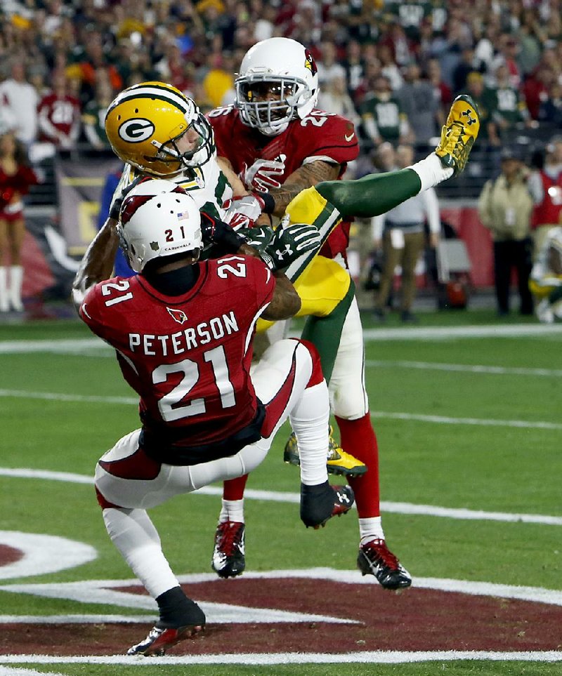 Green Bay wide receiver Jeff Janis (middle) grabs a touchdown pass from Aaron Rodgers on a “Hail Mary” throw in the NFL playoffs against Arizona in January 2016.