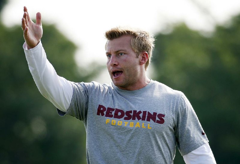 FILE - In this July 26, 2014 file photo, Washington Redskins offensive coordinator Sean McVay talks to the offense during practice at the team's NFL football training facility in Richmond, Va. 