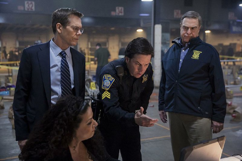 FBI Special Agent Richard DesLauriers (Kevin Bacon), Sgt. Tommy Saunders (Mark Wahlberg) and Police Commissioner Ed Davis (John Goodman) investigate a terrorist bombing in Patriots Day, Peter Berg’s dramatic examination of the events surrounding the 2013 Boston Marathon bombing.
