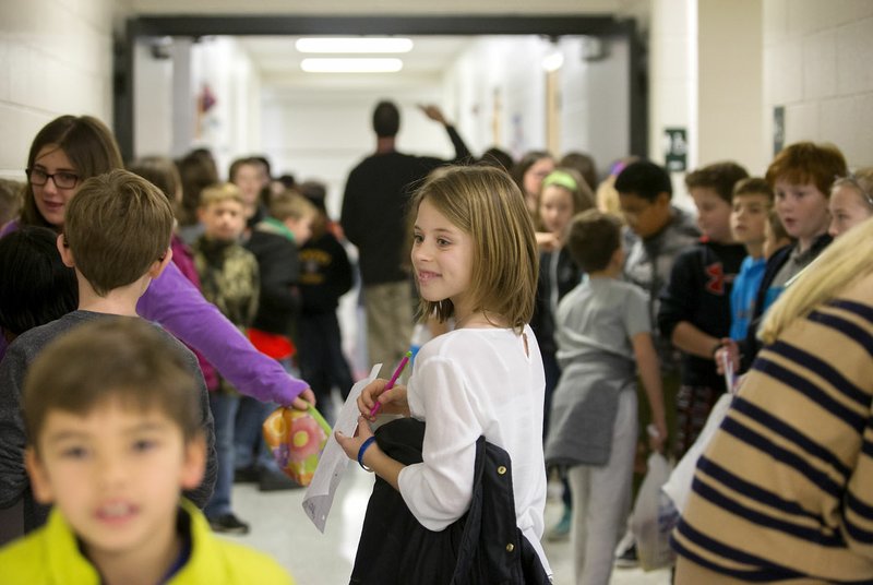 NWA Democrat-Gazette/JASON IVESTER Kate Marley, fourth-grader, and other students transition between lunch and classes Thursday at Elm Tree Elementary School in Bentonville. Elm Tree is projected to be over capacity by about 20 students when the next school year begins.