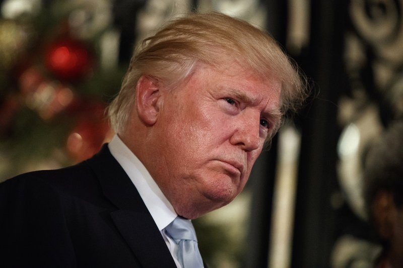  In this Wednesday, Dec. 28, 2016 file photo, President-elect Donald Trump listens to a question as he speaks to reporters at Mar-a-Lago, in Palm Beach, Fla. 