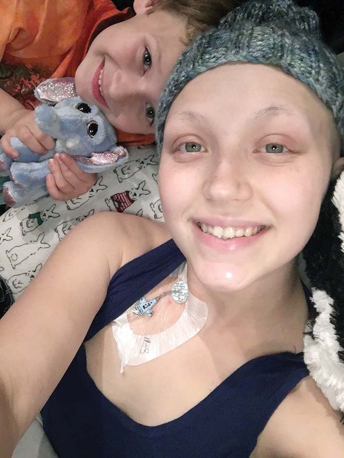 Kaitlyn Ison, 21, of Conway will be the beneficiary of the Championship Wrestling of Arkansas’ Wrestle Raise event, which will take place Saturday at the Maumelle Events Center. Ison, pictured with her son, Beau, was diagnosed with leukemia in July 2016. In her right shoulder is her central venous line, where she receives chemotherapy treatment.