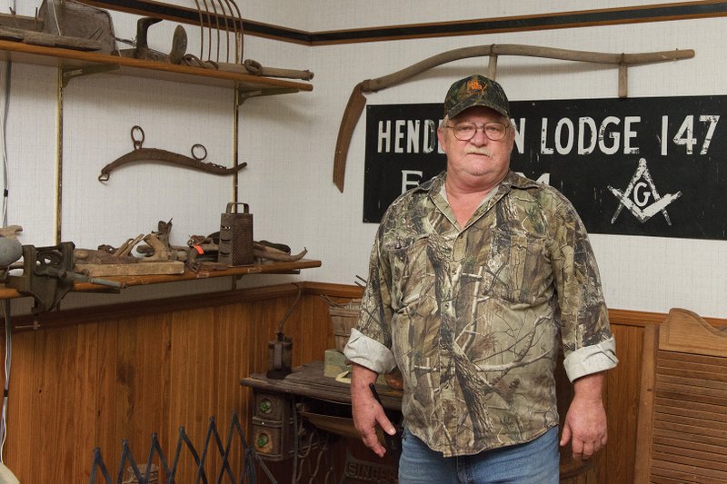Mountain Pine Mayor Rick Petty Sr. stands in front of some of the old tools and other items that are 
displayed in the Mountain Pine Historical Museum in City Hall. A former alderman, Petty won the mayor’s race in a runoff Nov. 29, 2016, after having served as interim mayor since July 12, 2016.