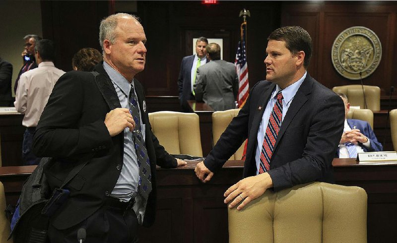 Sen. Jim Hendren (left), R-Sulphur Springs, talks with Sen. Bart Hester, R-Cave Springs, in this file photo.