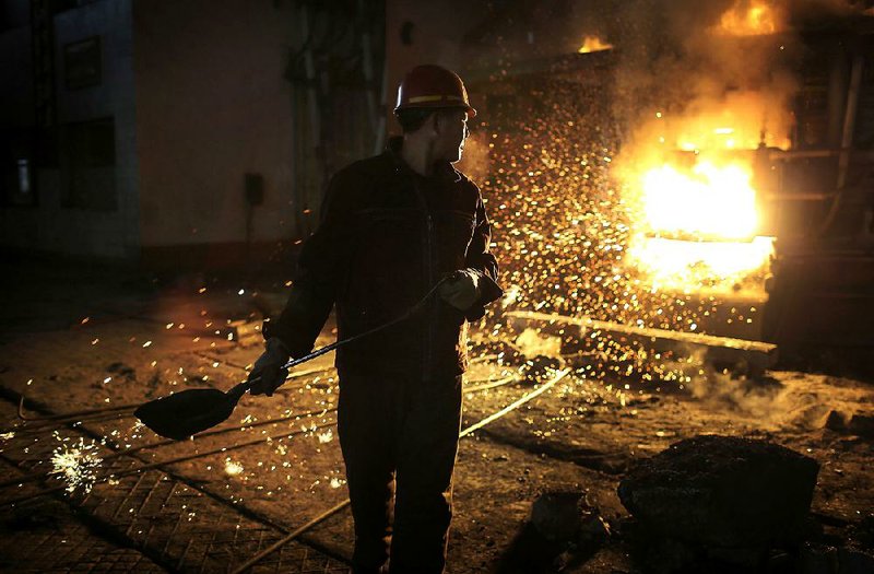 A worker tends a furnace at the Chollima Steel Complex in Nampo, North Korea, earlier this month. 